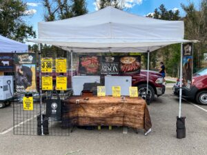 Big Heart Bison stand at a farmers market.